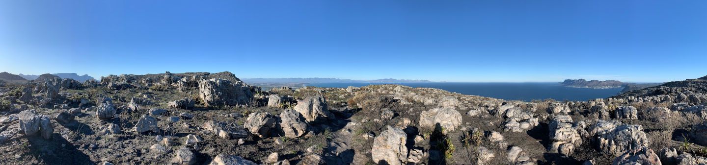 View from the top of Steenberg Peak, Cape Town — recovering your sleep routine feels like your world coming back into balance, sky above, earth below